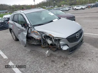 2014 Mazda CX-5 Touring with VIN JM3KE4CY1E0426409, listed as a IAAI auction lot 41924258 with 116,956 mi miles. Bid and sale history available at carsss.com. Image 1.