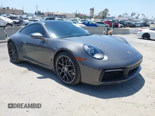 2022 Porsche 911 Carrera with VIN WP0AA2A94NS205939, listed as a IAAI auction lot 42204771 with 14,853 mi miles and . Bid and sale history available at DreamBid. Image 1.
