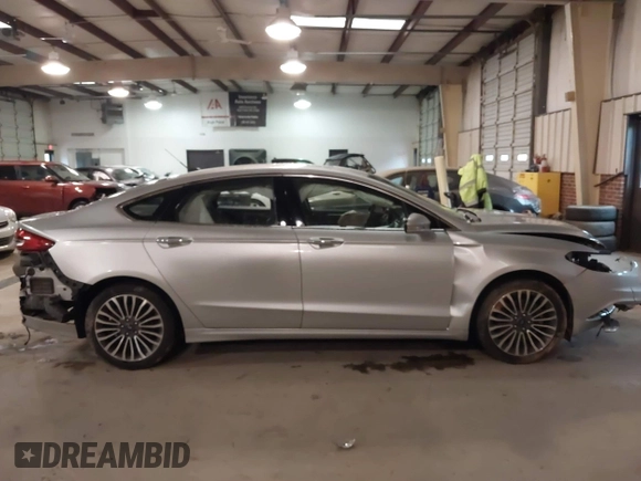 2017 Ford Fusion SE z VIN 3FA6P0H95HR203170, wystawiony jako IAAI lot #41569303 z przebiegiem 143 287 mil mil oraz . Historia ofert i sprzedaży dostępna na DreamBid. Obrazek 14.