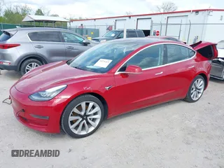 2018 Tesla Model 3 Long Range Battery with VIN 5YJ3E1EA8JF031683, listed as a IAAI auction lot 39275313 with 136,939 mi miles and . Bid and sale history available at DreamBid. Image 2.