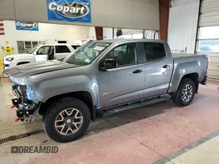 2022 GMC Canyon 4WD AT4 z VIN 1GTG6FEN7N1230317, wystawiony jako Copart lot #55382035 z przebiegiem 6 066 mil mil oraz Szkoda całkowita • Salvage title. Historia ofert i sprzedaży dostępna na DreamBid. Obrazek 1.