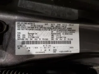 2012 Ford Focus SEL with VIN 1FAHP3H29CL386660, listed as a Copart auction lot 51447905 with 210,075 mi miles and Salvage Title. Bid and sale history available at carsss.com. Image 12.