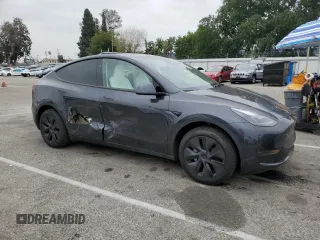 2025 Tesla Model Y Long Range with VIN 7SAYGDED8SF277469, listed as a Copart auction lot 45600195 with 442 mi miles and Salvage Title. Bid and sale history available at DreamBid. Image 4.