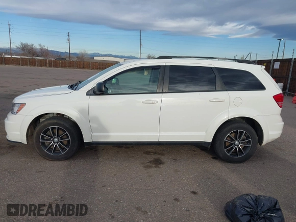 2017 Dodge Journey SE with VIN 3C4PDCAB6HT670624, listed as a IAAI auction lot 41777947 with 143,496 mi miles and . Bid and sale history available at DreamBid. Image 14.