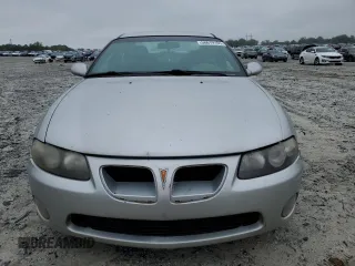 2004 Pontiac GTO z VIN 6G2VX12G74L183006, wystawiony jako Copart lot #58619105 z przebiegiem 281 390 mil mil oraz Tytuł czysty. Historia ofert i sprzedaży dostępna na DreamBid. Obrazek 5.