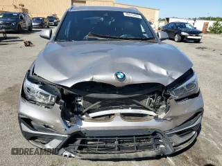 2021 BMW X1 sDrive28i with VIN WBXJG7C0XM5S33884, listed as a Copart auction lot 48413405 with 89,698 mi miles and Salvage Title. Bid and sale history available at DreamBid. Image 5.