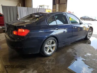 2014 BMW 3 Series 320i with VIN WBA3B1G5XENT00747, listed as a Copart auction lot 64737935 with 123,374 mi miles and Salvage title. Bid and sale history available at DreamBid. Image 3.