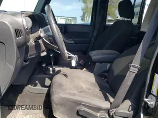 2018 Jeep Wrangler JK Unlimited Sport S with VIN 1C4BJWDG9JL812395, listed as a Copart auction lot 76397134 with 64,866 mi miles and Salvage Title. Bid and sale history available at carsss.com. Image 7.