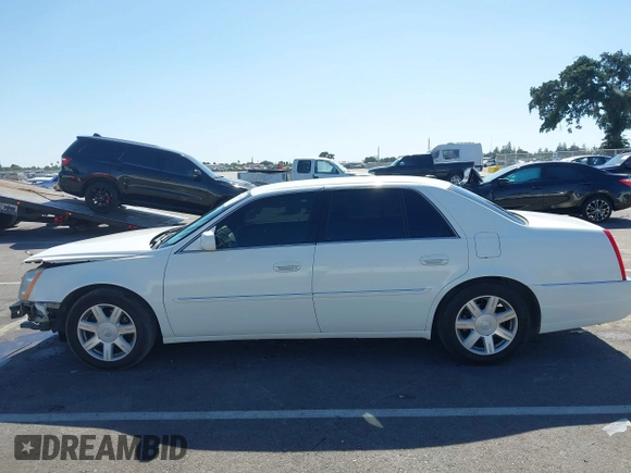 2007 Cadillac DTS Luxury I z VIN 1G6KD57Y77U133267, wystawiony jako IAAI lot #42337188 z przebiegiem 126 063 mil mil oraz . Historia ofert i sprzedaży dostępna na DreamBid. Obrazek 15.