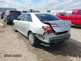 2014 Toyota Camry L with VIN 4T4BF1FK0ER384563, listed as a IAAI auction lot 41782381 with 75,868 mi miles. Bid and sale history available at carsss.com. Image 3.