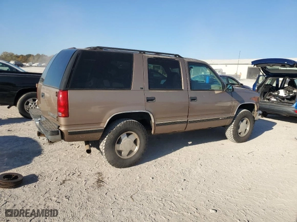 1996 Chevrolet Tahoe with VIN 1GNEK13R1TJ385350, listed as a Copart auction lot 77593884 with 169,178 mi miles and Salvage Title. Bid and sale history available at carsss.com. Image 3.