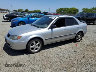 2002 Mazda Protege DX z VIN JM1BJ225320541640, wystawiony jako Copart lot #56980435 z przebiegiem 173 508 mil mil oraz Szkoda całkowita • Salvage title. Historia ofert i sprzedaży dostępna na DreamBid. Obrazek 1.