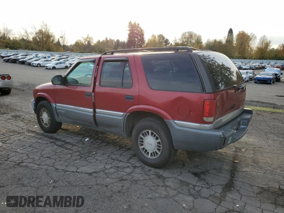 1999 GMC Jimmy SLE with VIN 1GKDT13W6X2508118, listed as a Copart auction lot 79761444 with 195,738 mi miles and Salvage Title. Bid and sale history available at carsss.com. Image 2.