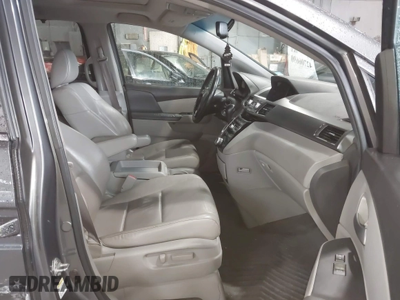 2012 Honda Odyssey EX-L with VIN 5FNRL5H63CB137198, listed as a IAAI auction lot 42706690 with 305,753 mi miles and . Bid and sale history available at DreamBid. Image 5.
