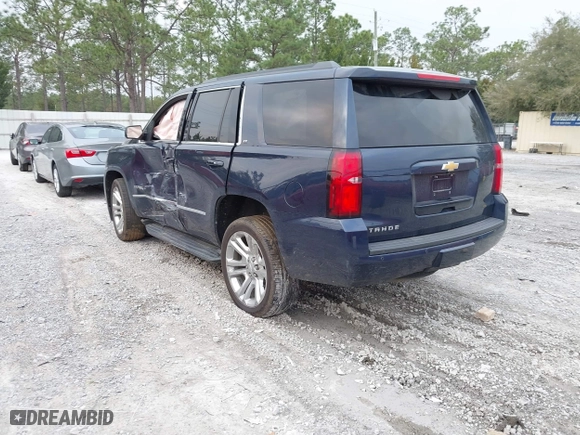 2019 Chevrolet Tahoe LT with VIN 1GNSCBKC7KR133119, listed as a IAAI auction lot 41570650 with 114,575 mi miles. Bid and sale history available at carsss.com. Image 3.