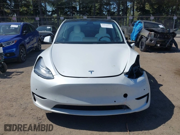 2022 Tesla Model Y Long Range z VIN 7SAYGDEE7NF418223, wystawiony jako IAAI lot #42046651 z przebiegiem 18 724 mil mil oraz . Historia ofert i sprzedaży dostępna na DreamBid. Obrazek 13.