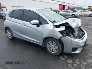 2015 Honda Fit LX z VIN 3HGGK5H51FM734921, wystawiony jako IAAI lot #41760618 z przebiegiem 111 079 mil mil oraz . Historia ofert i sprzedaży dostępna na DreamBid. Obrazek 1.