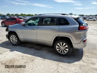 2016 Jeep Cherokee Overland z VIN 1C4PJMJSXGW300719, wystawiony jako Copart lot #58216665 z przebiegiem 128 016 mil mil oraz Szkoda całkowita • Salvage title. Historia ofert i sprzedaży dostępna na DreamBid. Obrazek 2.