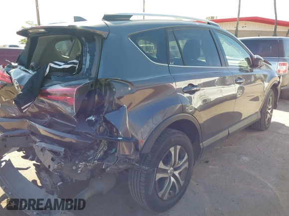 2016 Toyota RAV4 LE with VIN JTMBFREV4GJ052168, listed as a IAAI auction lot 41837564 with 73,659 mi miles. Bid and sale history available at carsss.com. Image 4.