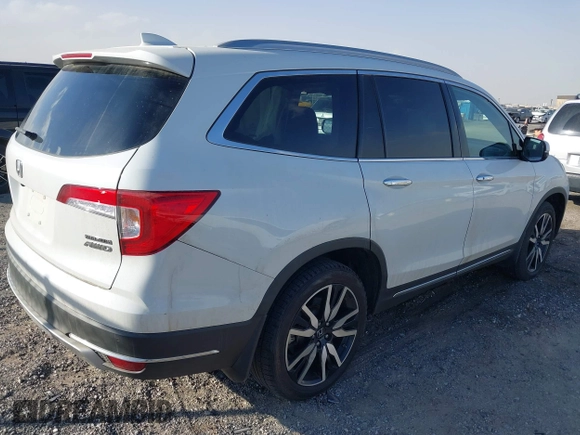 2022 Honda Pilot Touring 7-Passenger with VIN 5FNYF6H67NB017660, listed as a IAAI auction lot 41194603 with 87,301 mi miles. Bid and sale history available at carsss.com. Image 4.