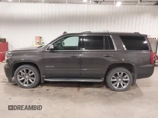2016 Chevrolet Tahoe LTZ with VIN 1GNSKCKC1GR201155, listed as a IAAI auction lot 42235228 with 184,585 mi miles and . Bid and sale history available at DreamBid. Image 14.