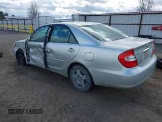 2004 Toyota Camry LE with VIN JTDBE32K640257695, listed as a IAAI auction lot 41837872 with 214,917 mi miles. Bid and sale history available at carsss.com. Image 3.