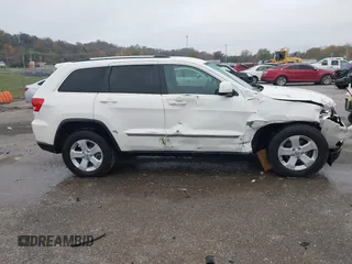 2012 Jeep Grand Cherokee Laredo with VIN 1C4RJFAG6CC297958, listed as a IAAI auction lot 40859811 with 213,499 mi miles. Bid and sale history available at carsss.com. Image 13.
