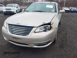 2014 Chrysler 200 LX with VIN 1C3CCBAB2EN213983, listed as a IAAI auction lot 42006774 with 80,615 mi miles and . Bid and sale history available at carsss.com. Image 17.