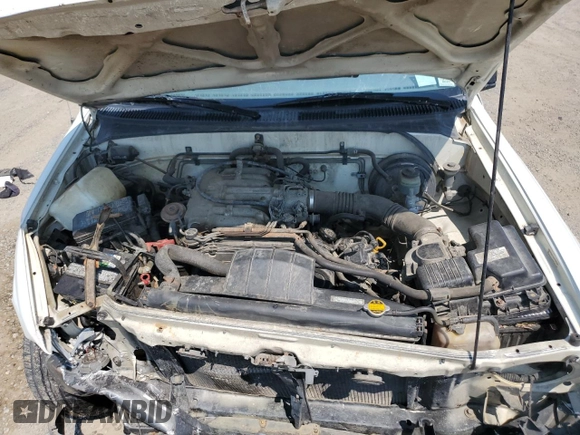 1993 Toyota T100 DX z VIN JT4VD10A5P0010588, wystawiony jako Copart lot #63862014 z przebiegiem 295 012 mil mil oraz Czysty tytuł • Clean title. Historia ofert i sprzedaży dostępna na DreamBid. Obrazek 11.