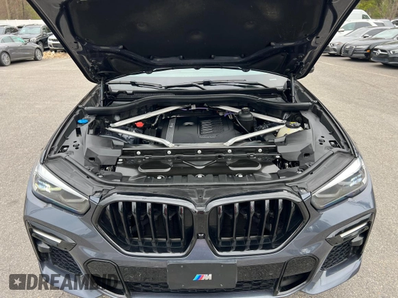 2021 BMW X6 sDrive40i z VIN 5UXCY4C05M9H19479, wystawiony jako Copart lot #54268205 z przebiegiem 85 899 mil mil oraz Czysty tytuł • Clean title. Historia ofert i sprzedaży dostępna na DreamBid. Obrazek 8.