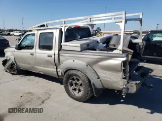 2002 Nissan Frontier SE with VIN 1N6ED27T52C383700, listed as a Copart auction lot 86204074 with 216,908 mi miles and Salvage title. Bid and sale history available at DreamBid. Image 2.