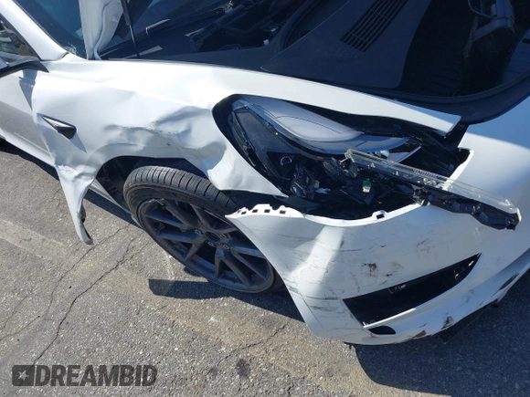 2023 Tesla Model 3 with VIN 5YJ3E1EA0PF621448, listed as a IAAI auction lot 42500155 with 26,589 mi miles and . Bid and sale history available at DreamBid. Image 6.