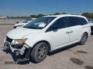 2012 Honda Odyssey EX-L with VIN 5FNRL5H61CB019215, listed as a IAAI auction lot 41837320 with 248,498 mi miles and . Bid and sale history available at DreamBid. Image 2.