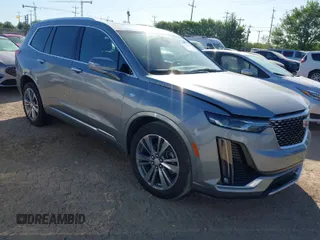 2025 Cadillac XT6 FWD Premium Luxury with VIN 1GYKPCRS3SZ118384, listed as a IAAI auction lot 41962391 with 6,946 mi miles. Bid and sale history available at carsss.com. Image 1.