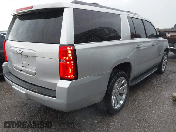 2015 Chevrolet Suburban LT with VIN 1GNSCJKC9FR617227, listed as a IAAI auction lot 42127511 with 167,924 mi miles and . Bid and sale history available at DreamBid. Image 4.