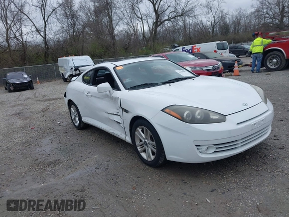 2008 Hyundai Tiburon GS z VIN KMHHM66D58U283273, wystawiony jako IAAI lot #41900097 z przebiegiem 154 013 mil mil oraz . Historia ofert i sprzedaży dostępna na DreamBid. Obrazek 1.