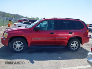 2005 GMC Envoy SLT with VIN 1GKDS13SX52144959, listed as a IAAI auction lot 41968495 with 238,199 mi miles. Bid and sale history available at carsss.com. Image 14.