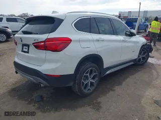 2018 BMW X1 xDrive28i with VIN WBXHT3C35J5K24695, listed as a IAAI auction lot 40932205 with 66,354 mi miles. Bid and sale history available at carsss.com. Image 4.
