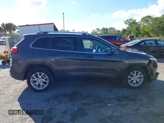2016 Jeep Cherokee Altitude with VIN 1C4PJLCSXGW363598, listed as a IAAI auction lot 41670125 with 135,603 mi miles. Bid and sale history available at carsss.com. Image 13.
