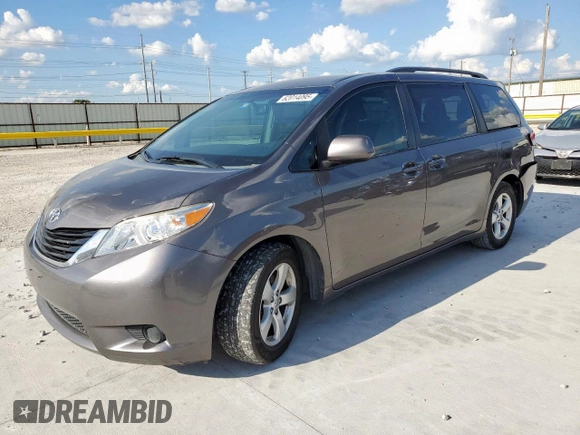 2014 Toyota Sienna LE AAS with VIN 5TDKK3DC8ES445454, listed as a Copart auction lot 62014095 with 143,601 mi miles and Salvage title. Bid and sale history available at DreamBid. Image 1.