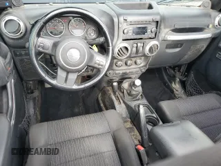 2011 Jeep Wrangler Rubicon with VIN 1J4BA6D12BL507652, listed as a Copart auction lot 69989964 with 127,493 mi miles and Salvage title. Bid and sale history available at DreamBid. Image 8.