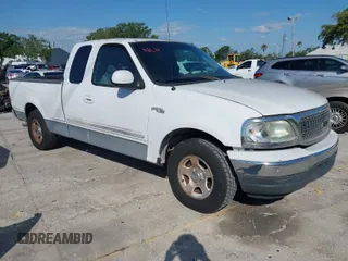 2002 Ford F-150 XL with VIN 1FTRX17WX2NA92467, listed as a IAAI auction lot 41977334 with 176,902 mi miles. Bid and sale history available at carsss.com. Image 1.