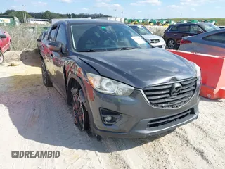 2016 Mazda CX-5 Grand Touring with VIN JM3KE2DYXG0769578, listed as a IAAI auction lot 41504987 with 96,541 mi miles. Bid and sale history available at carsss.com. Image 1.