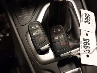 2015 Jeep Cherokee Trailhawk with VIN 1C4PJMBS2FW609999, listed as a IAAI auction lot 41582536 with 133,666 mi miles. Bid and sale history available at carsss.com. Image 11.
