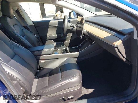 2019 Tesla Model 3 Mid Range with VIN 5YJ3E1EA0KF425079, listed as a IAAI auction lot 41871022 with 61,684 mi miles and . Bid and sale history available at DreamBid. Image 5.