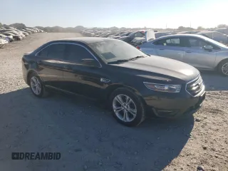 2015 Ford Taurus SEL with VIN 1FAHP2E90FG148821, listed as a Copart auction lot 77557384 with 141,514 mi miles and Salvage Title. Bid and sale history available at DreamBid. Image 4.