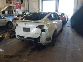 2021 Tesla Model Y Performance with VIN 5YJYGDEF4MF263473, listed as a IAAI auction lot 41851083 with 39,289 mi miles and . Bid and sale history available at DreamBid. Image 4.
