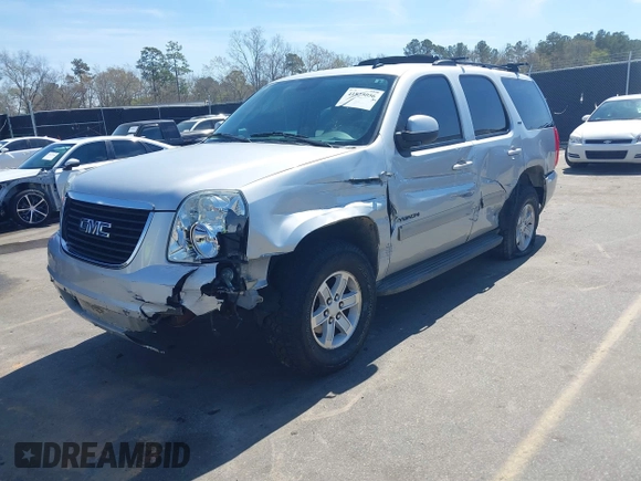 2014 GMC Yukon SLT with VIN 1GKS1CE04ER121301, listed as a IAAI auction lot 41825056 with 141,562 mi miles. Bid and sale history available at carsss.com. Image 2.