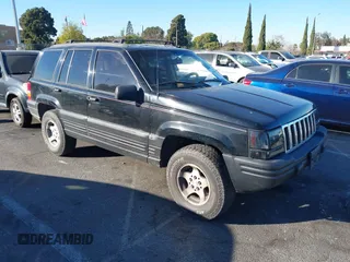 1998 Jeep Grand Cherokee Laredo with VIN 1J4FX58S8WC121904, listed as a IAAI auction lot 41145207 with 222,134 mi miles. Bid and sale history available at carsss.com. Image 1.