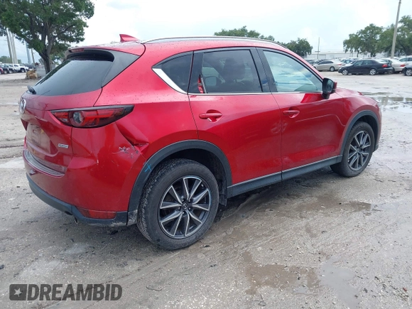 2018 Mazda CX-5 Grand Touring with VIN JM3KFADM5J0437365, listed as a IAAI auction lot 42657919 with 96,760 mi miles and . Bid and sale history available at DreamBid. Image 4.
